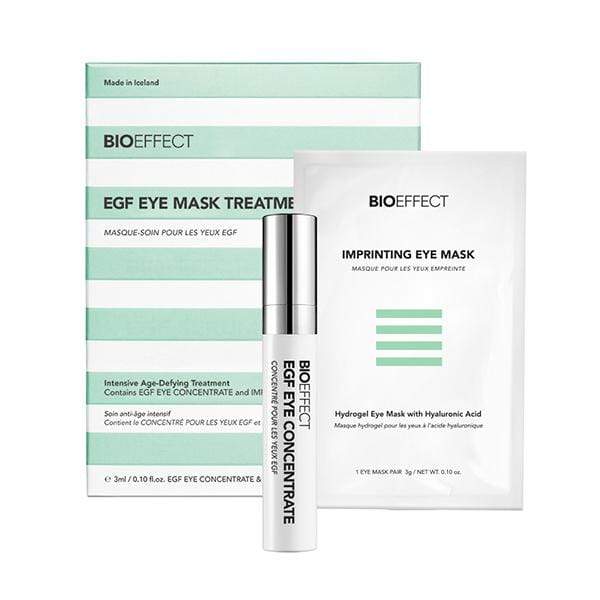 Green-and-white striped square-shaped package of BIOEFFECT Anti Aging Skincare EGF Hydrating Eye Mask Treatment. A small white Imprinting Eye Mask package and an EGF Eye Concentrate roller bottle sit towards the right center.